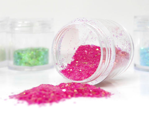 pink glitter spilling out of a clear container