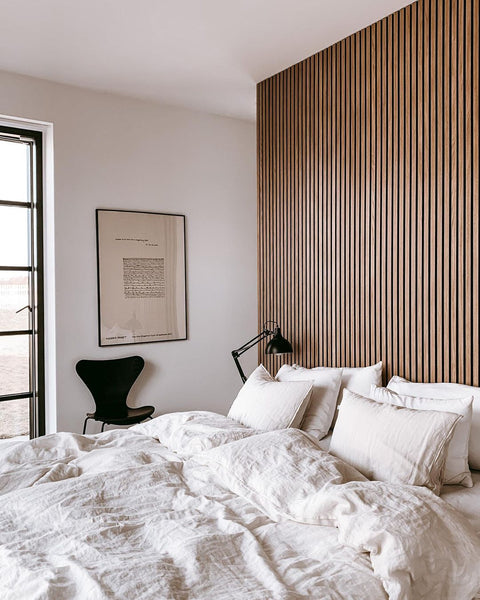 vertical wood slat accent wall in nordic bedroom