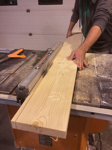 cutting pine boards into slats for wood slat accent wall
