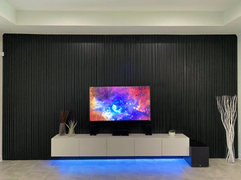 black wood slat accent wall with tv and LED media unit