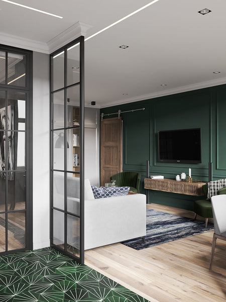 modern victorian apartment with hardwood flooring and a forest green tv wall with a black floor-to-ceiling glass partition