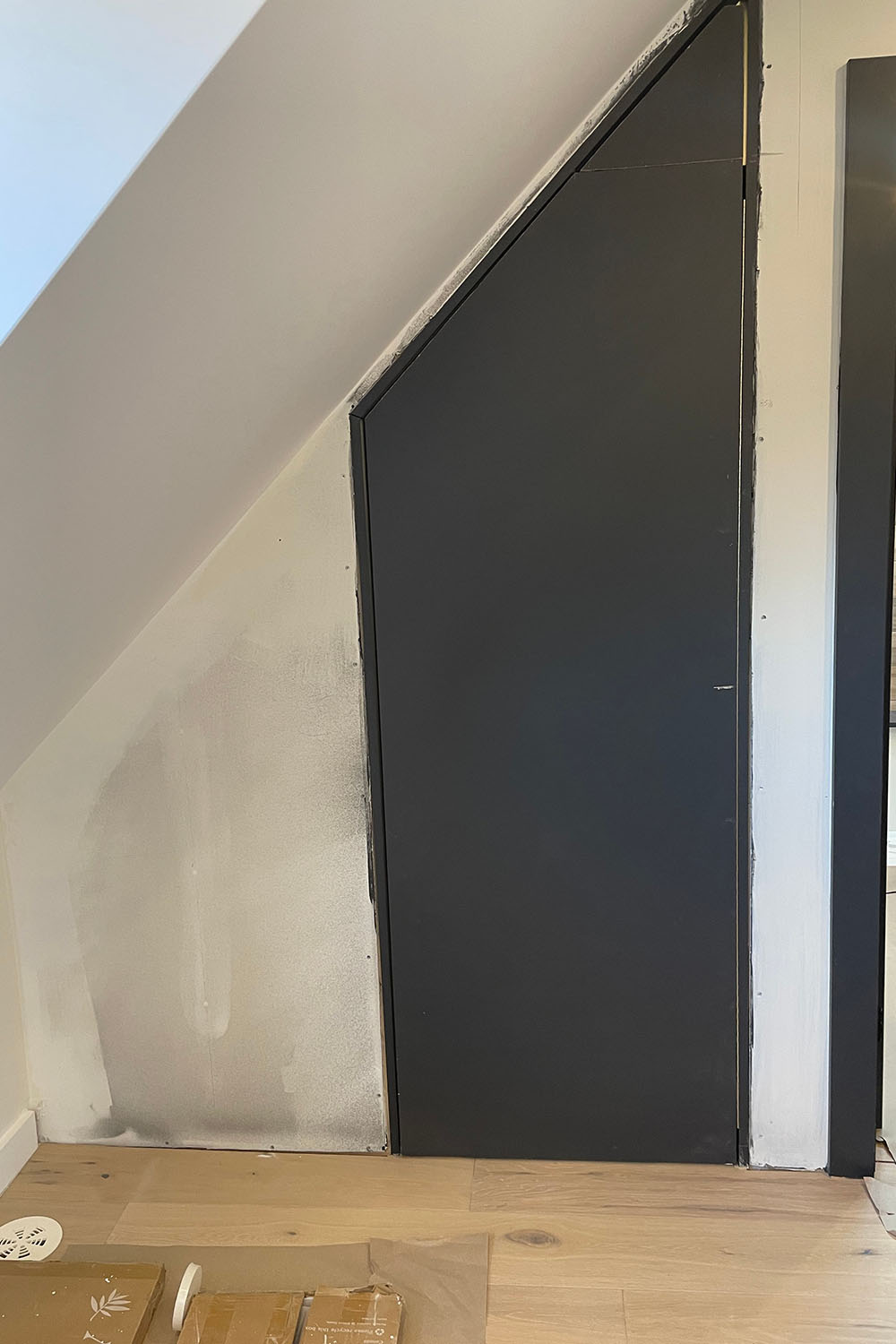 black angular door during renovation of modern home