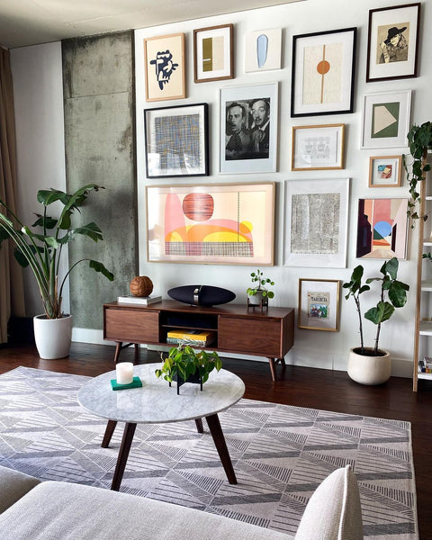 framed art Tv gallery wall with midcentury modern furniture in LA apartment