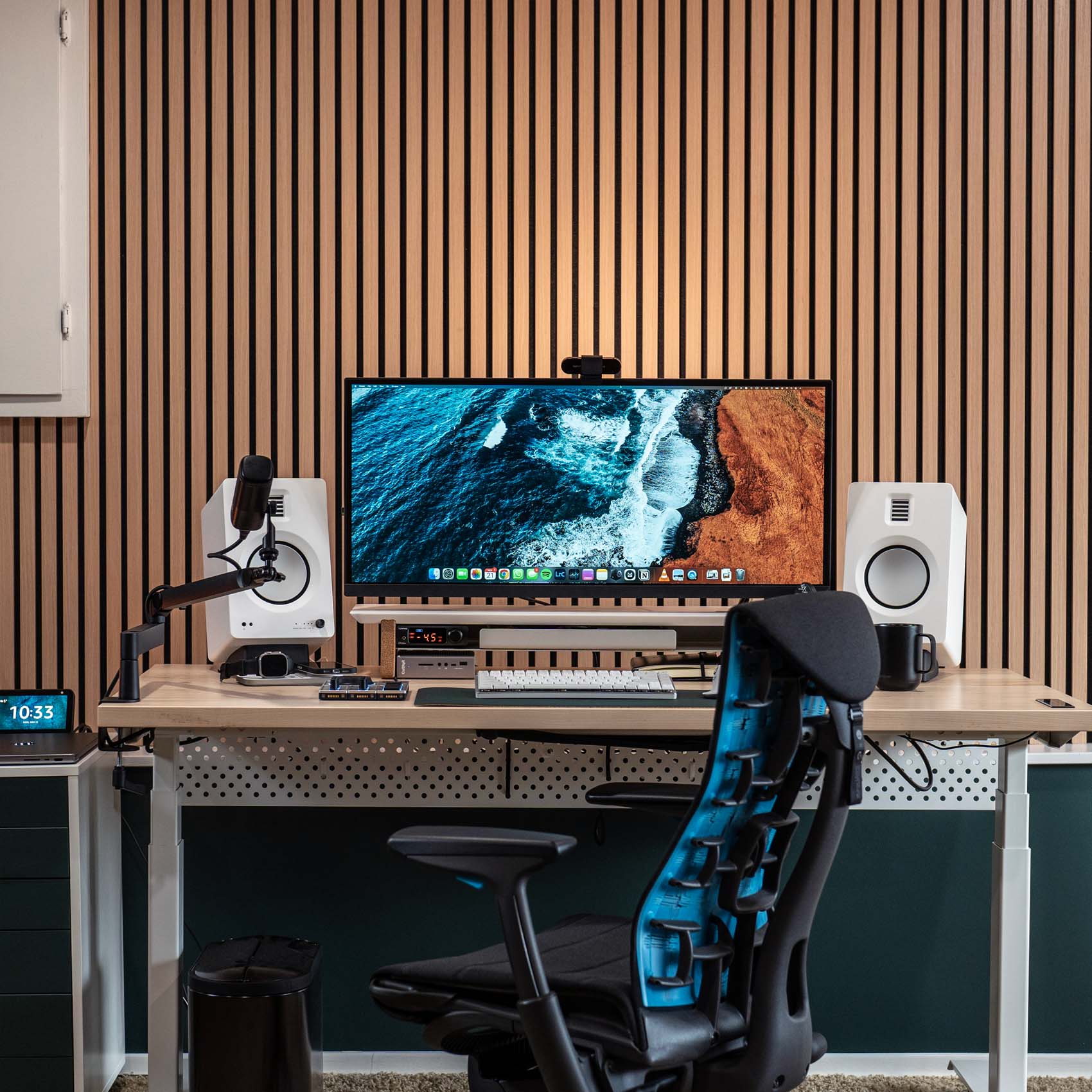 wood slat accent wall in home office with acoustic panels