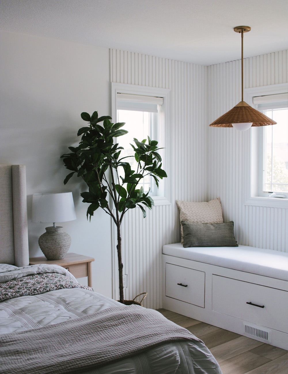 modern bedroom with white slatted accent wall in background