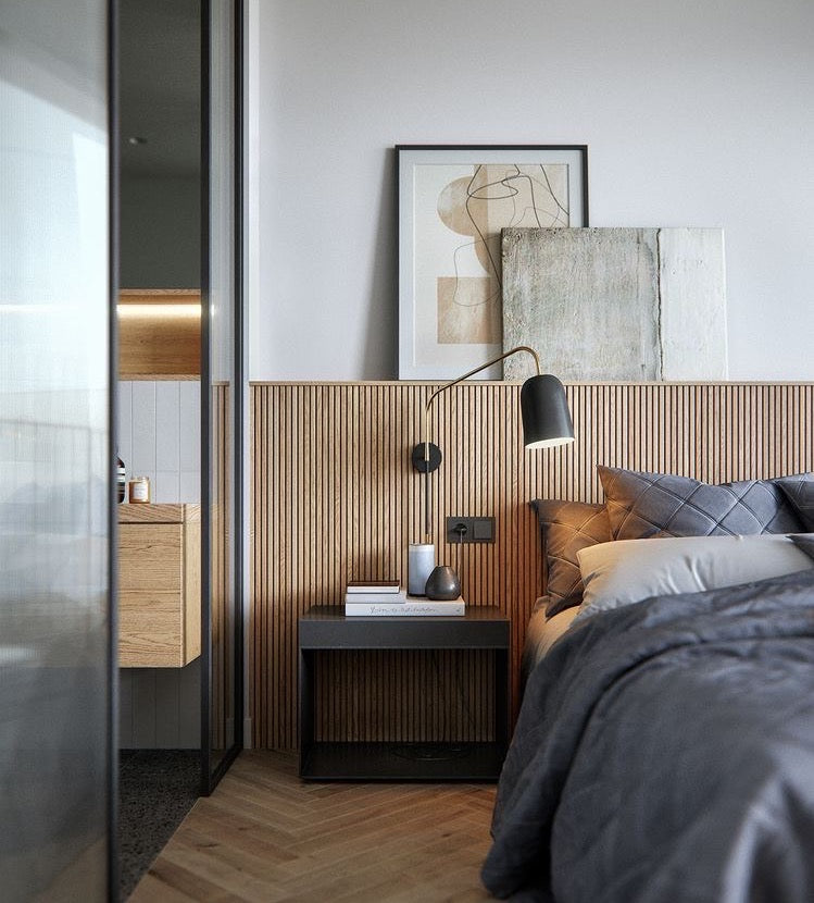 modern bedroom design with herringbone oak flooring and a vertical wood slat headboard behind the bed
