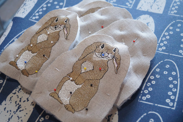 Embroidered rabbit egg cosies by Kate Sproston Design during the making process