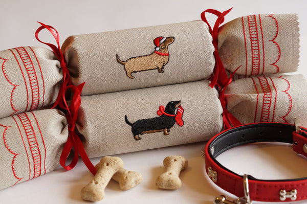 Embroidered fabric reusable Christmas crackers with dachshund motif by Kate Sproston Design