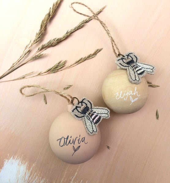 Wooden baubles with embroidered bee charm by Kate Sproston Design and Perched Bird