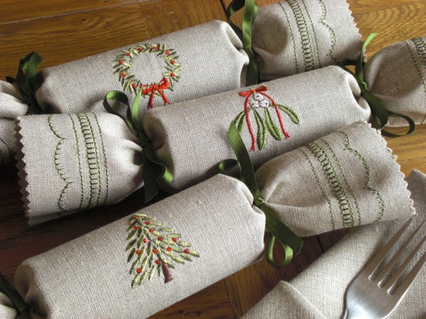 Wreath, mistletoe and pine tree reusable Christmas crackers.