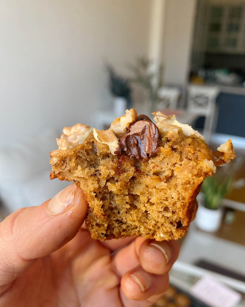 A bite out of sourdough banana chocolate chip muffin