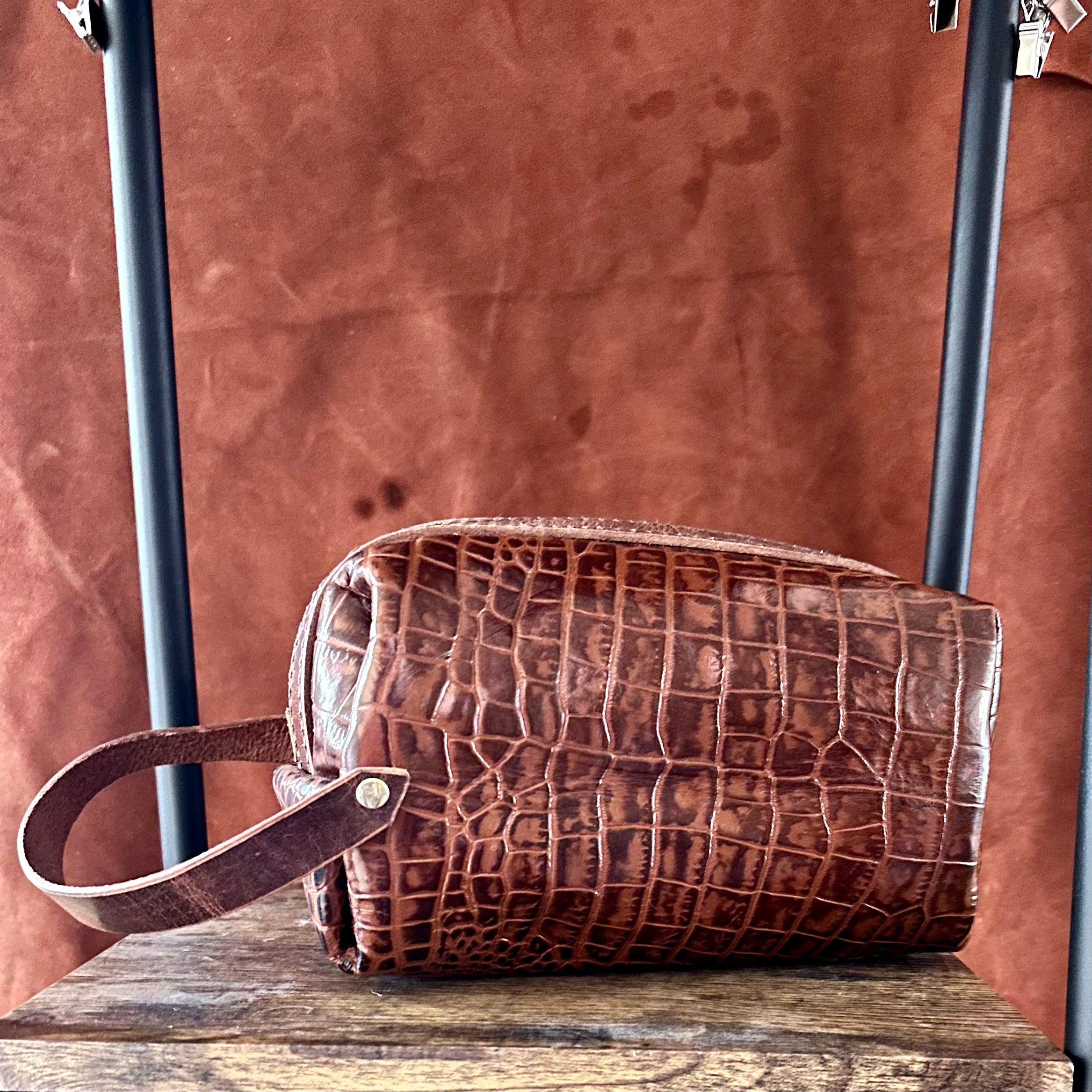 Alligator embossed toiletry bag