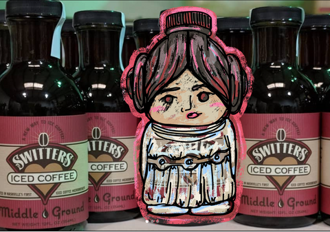 A drawing of Princess Leia photoshopped into a picture of Switters Middle Ground bottles.