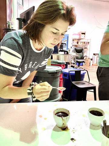 Local Nashville iced coffee microbrewery owner, Sheri, sips coffee to test for quality and flavor. 