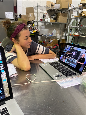 Switters owner, Sheri, pauses her work at Nashville's Iced Coffee Microbrewery, Switters, as watches the livestream of the James Webb telescope images appear on her laptop. 