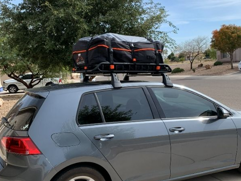 roof cargo basket mounted to the vehicle roof rack