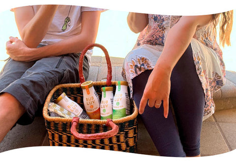 Friends around basket of BUBLUV Bubble Tea with different flavors