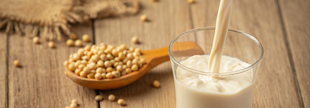 Pouring fresh soy milk in a glass