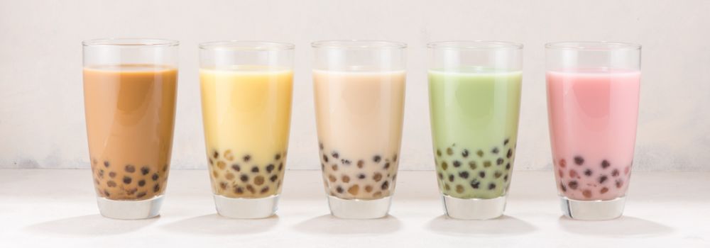 Different Flavors of Boba Tea in a Line