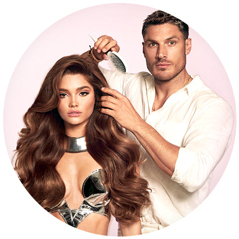 chris appleton with a model with wavy brown hair