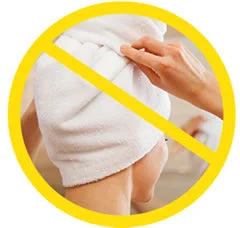 Image of a tightly-wrapped towel on hair with an X over it. 