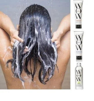 Image of a woman washing her hair next to Color Wow Color Security Shampoo and Conditioner, and Dream Cocktail Kale-Infused.