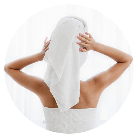 woman wearing a white towel on top of her head