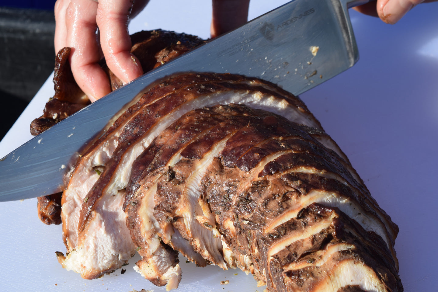 Smoked Thanksgiving turkey breast being sliced