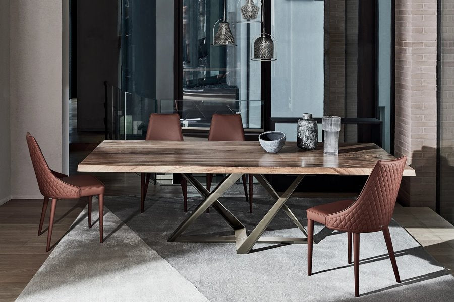 Millennium Dining Table in solid Walnut and aluminum base. Clara dining chairs featured in top grain leather.