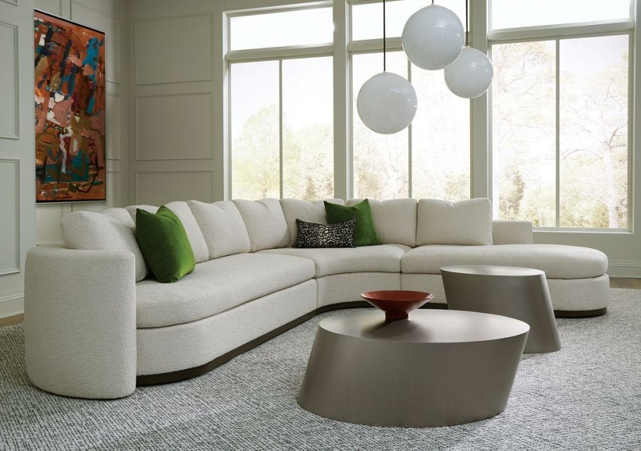 Playing Hooky sectional sofa paired with our Pisa cocktail tables