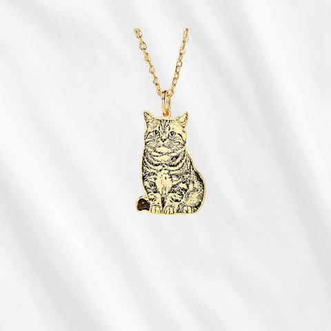 A personalized pet portrait necklace depicts your dog or cat as the way it is!