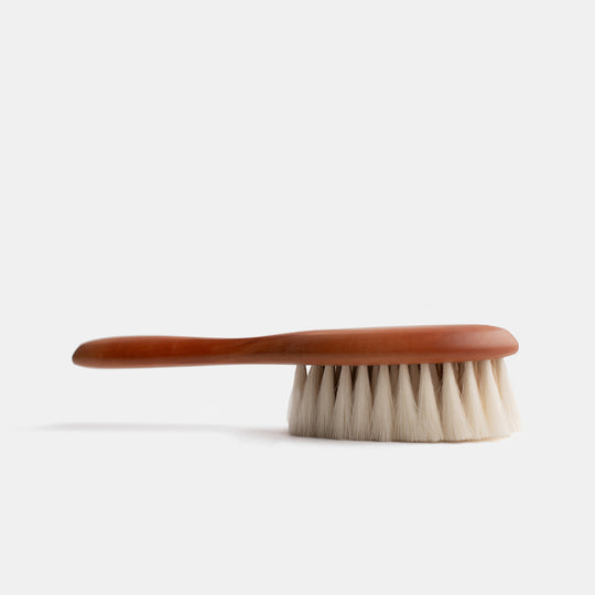 https://cdn.shopify.com/s/files/1/0587/7943/5168/products/redecker-baby-hairbrush-pearwood-helen-milan-standing_540x.jpg?v=1655925145