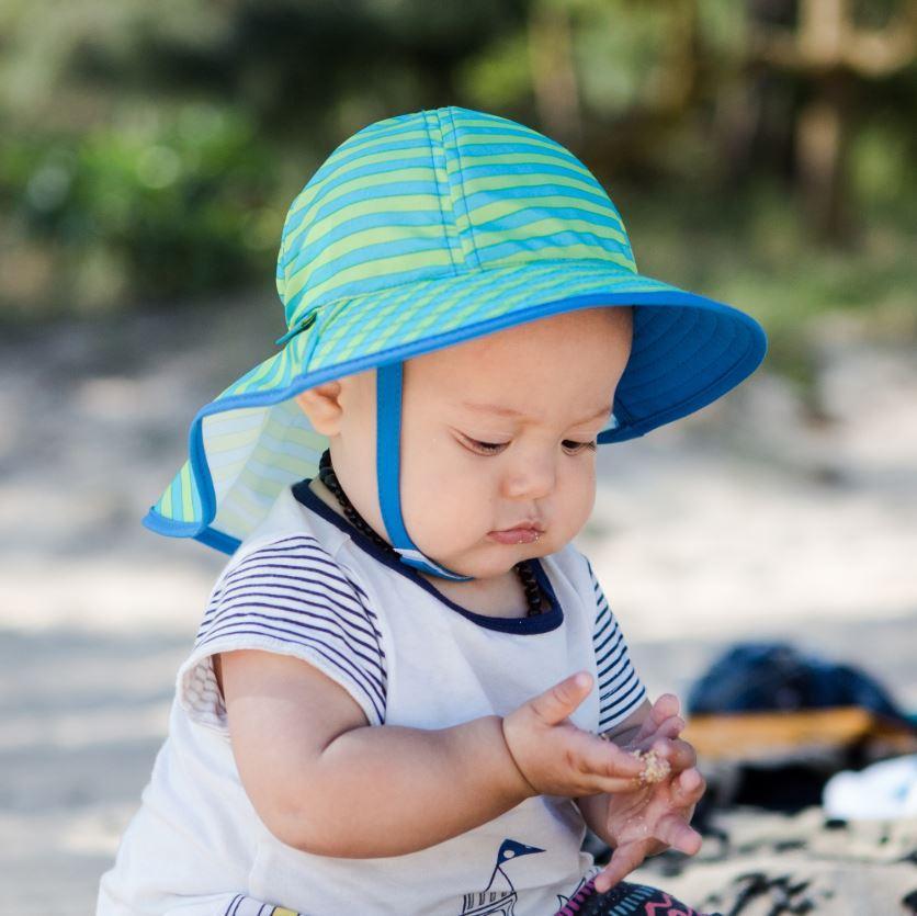 A baby wearing infant sunsprout hat