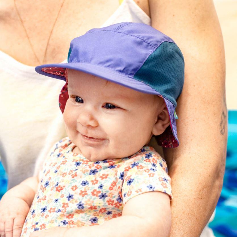 Infant wearing sun flip hat