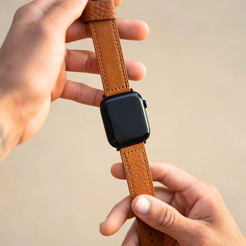 Buckle and Band luxury leather Apple Watch strap being held between someones hands