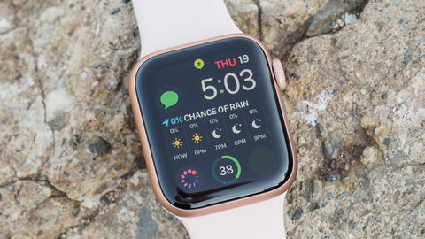 Apple Watch Series 5 laying on some rocks