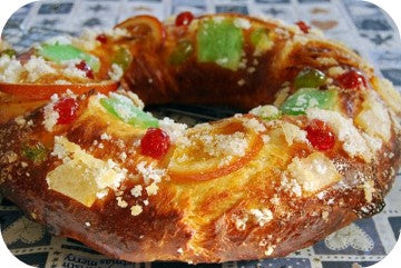 a circular cake with sweets on top 