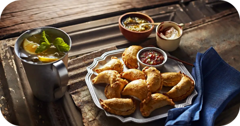 empanadas with food and drink