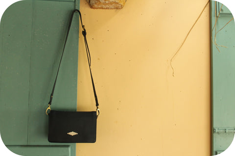 bag hanging from a door