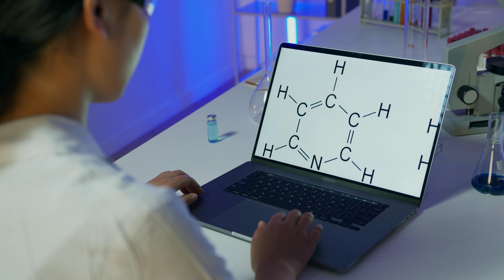 medical cannabis researcher at a laptop looking at CBD compound