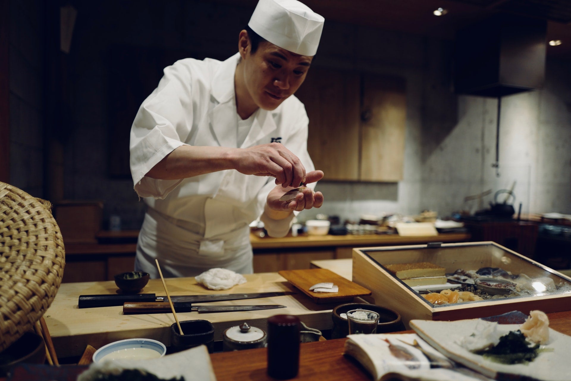 Japanese chef preparing sushi in Milan