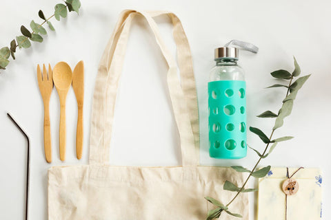 zero-waste drink bottle, bag and bamboo knife and fork 