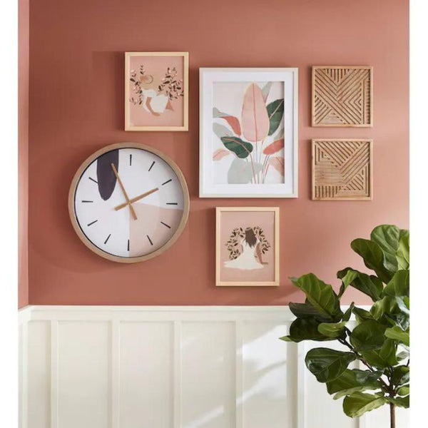 a wall clock is decorated with a gallery