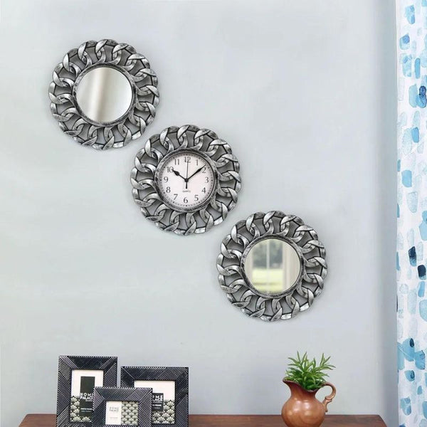 mirror and wall clocks all together