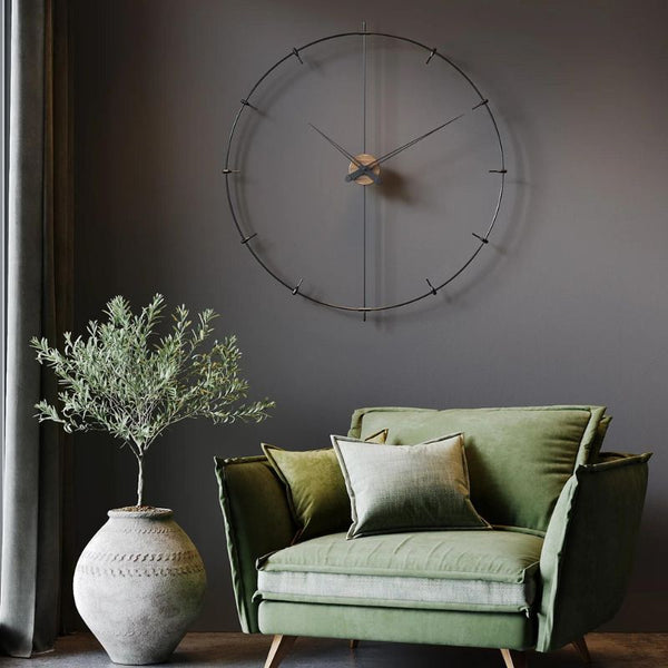 Utilise indoor plants and green coach to decorate around a wall clock