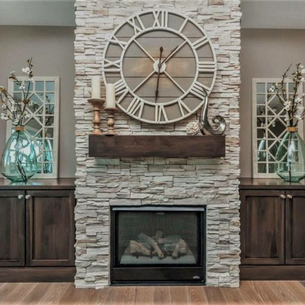 Wall clock is mounted over fireplace to decor wall around a clock.