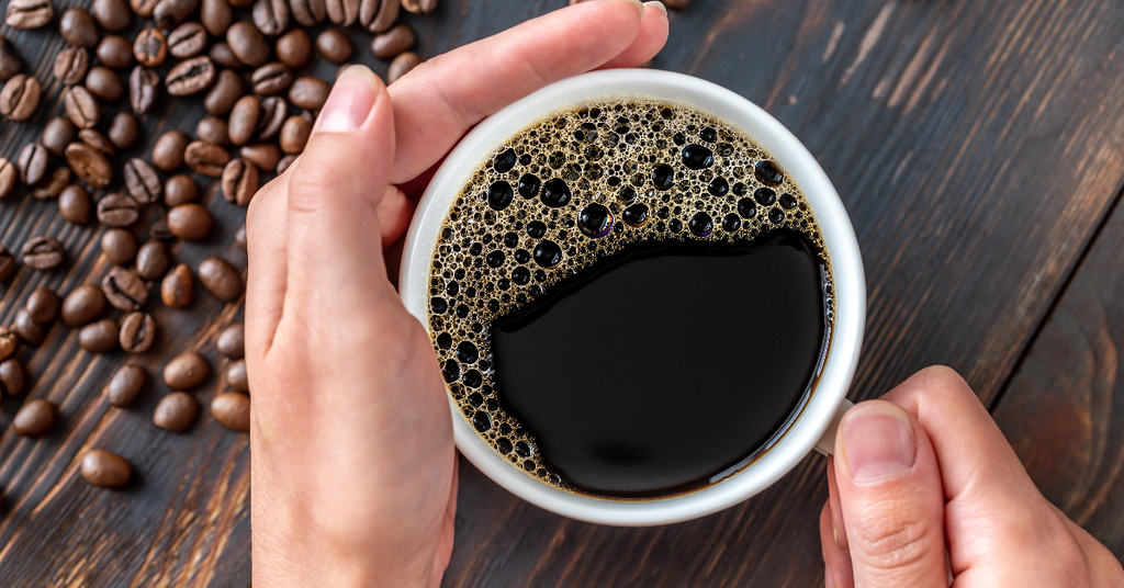 cup of coffee with coffee beans