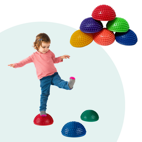 child walking across balance pods