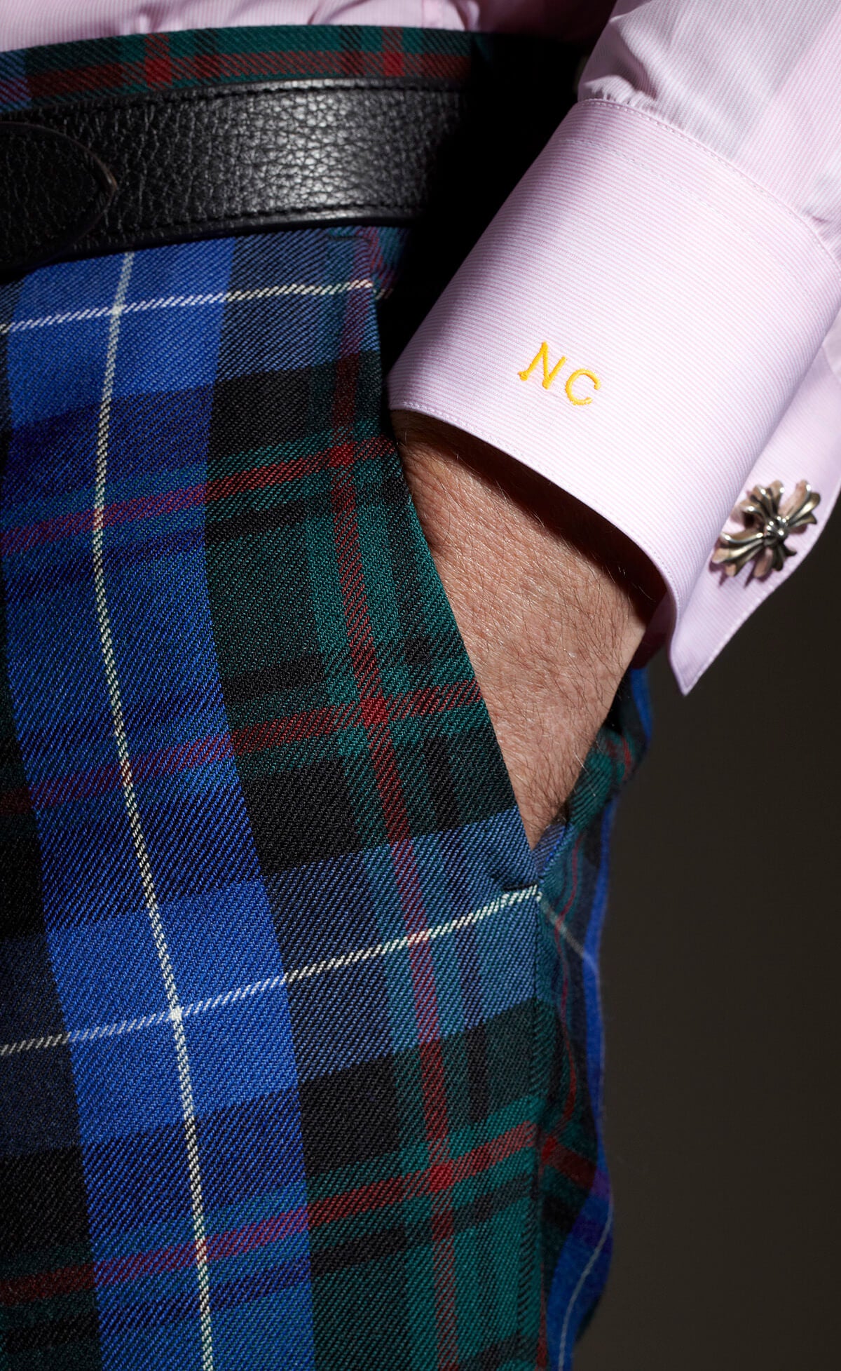 Detail image of man's hand in pocket of Nigel Curtiss tartan trousers