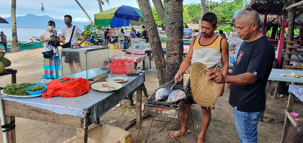 Locals cooking Fish